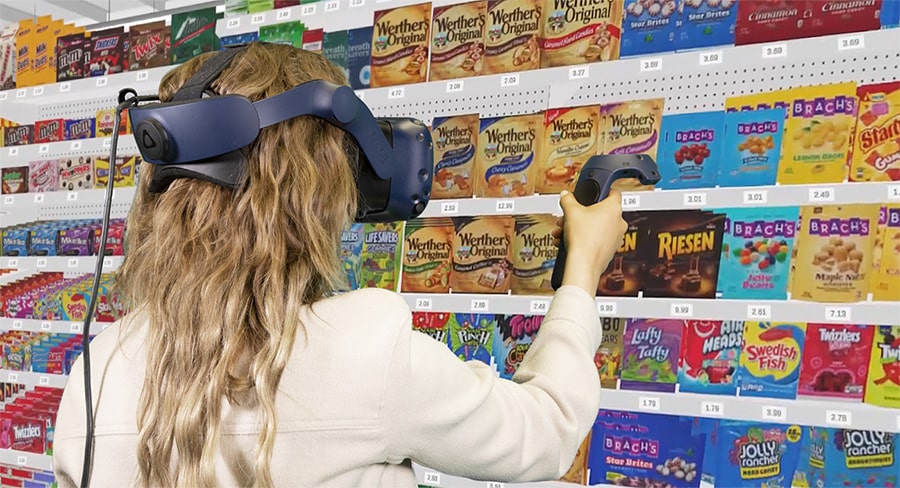 Woman shopping candy aisle in virtual reality