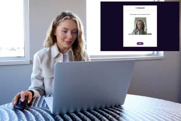 Woman on computer using face recognition technology