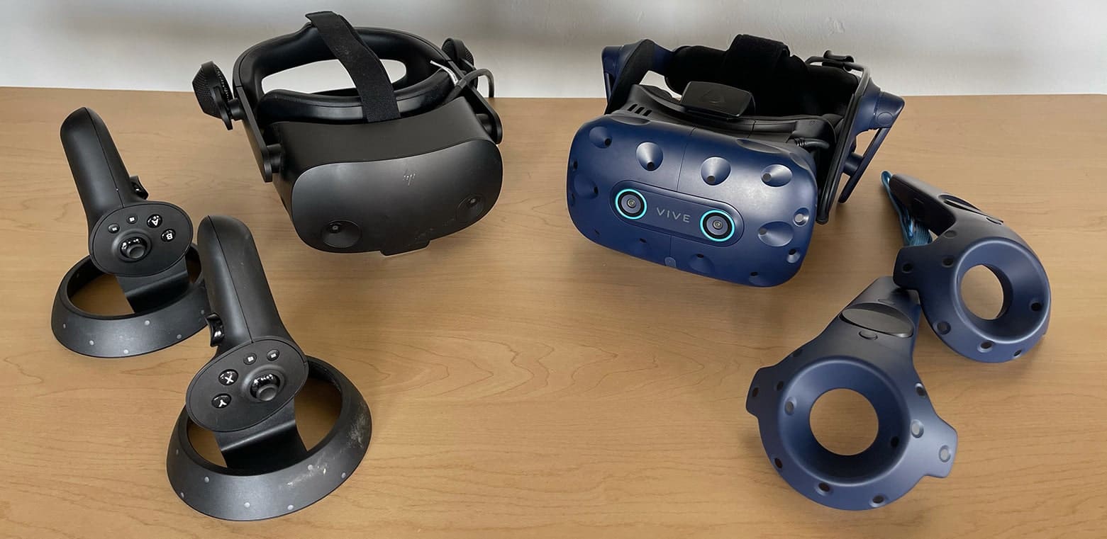 HP Reverb Omnicept VR Headset on table next to HTC Vive Eye Pro VR Headset