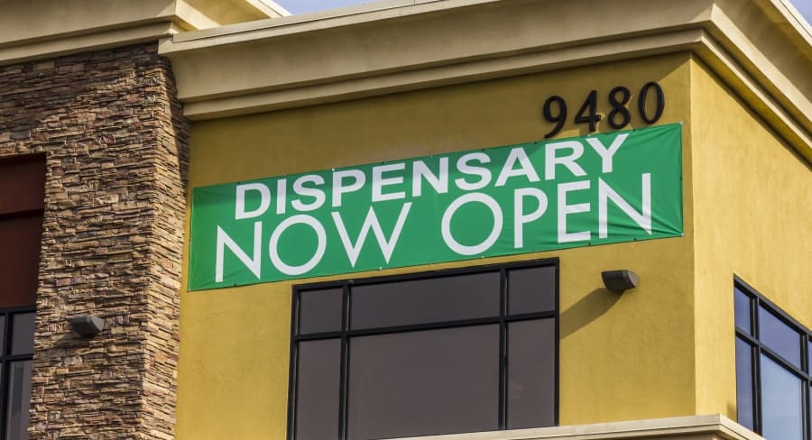 New cannabis dispensary now open sign on building