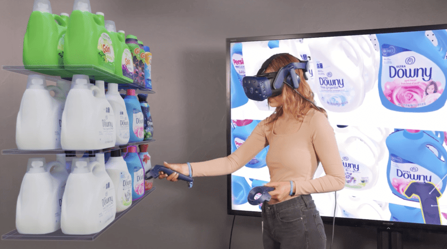 Woman in VR headset creating a 3D laundry detergent planogram in virtual reality retail lab