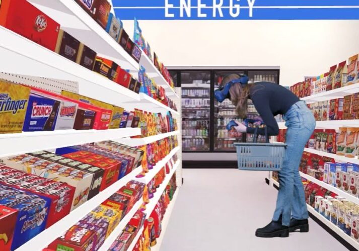 blog_candy-bar-and-snack-industry-use-vr-to-keep-up-with-consumers-min Candy, Bar, and Snack Industry use VR to Keep Up with Consumers - Woman wearing a VR headset in a 3D convenience store looking at snack aisle